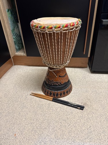 Hand carved wooden djembe drum - hand,